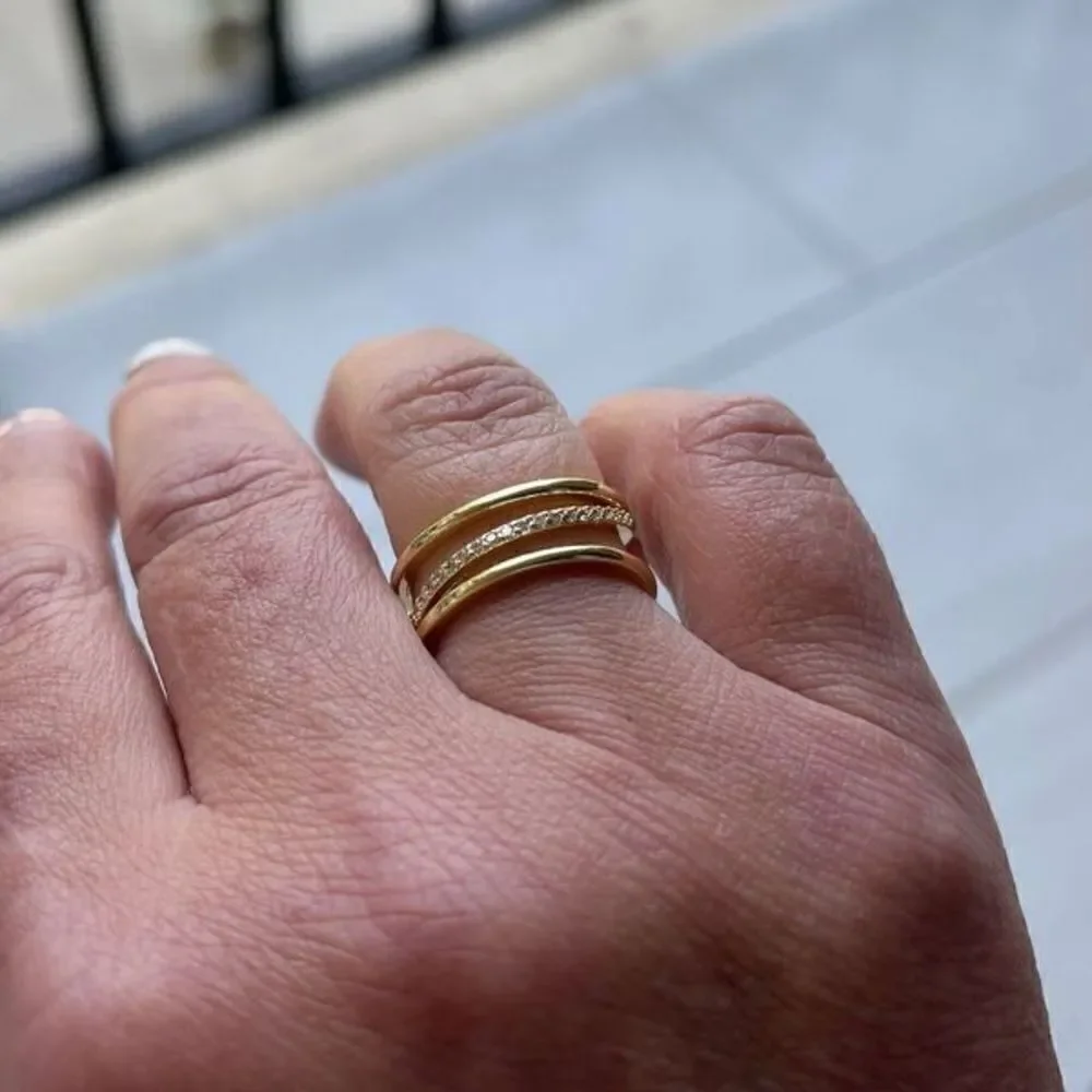 The Triple Bling Ring adjustable in 14k gold over 925 with cubic zirconia